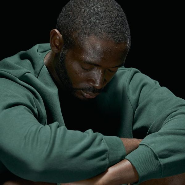 Close-up of a person meditating with serene expression.